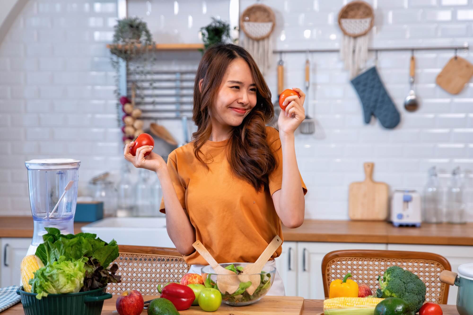 Young woman cooking fresh organic food